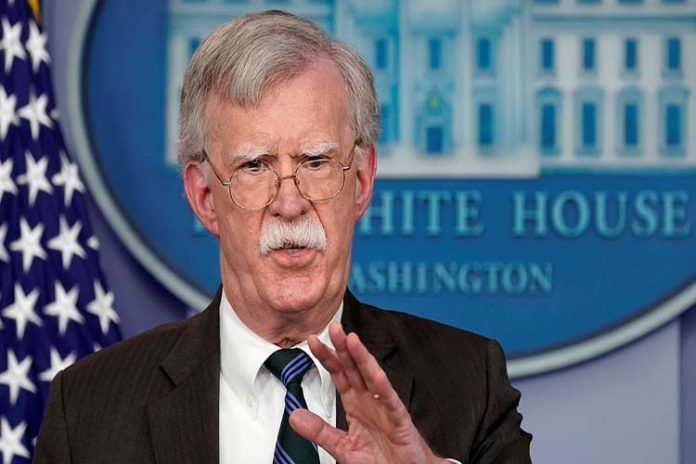 FILE PHOTO: Bolton speaks during a press briefing at the White House in Washington
